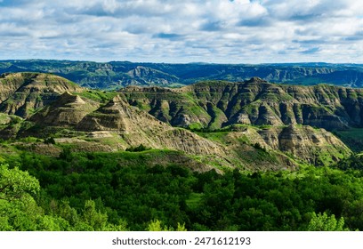 Explore the breathtaking natural beauty of the majestic green canyon landscape with rugged terrain, lush greenery, and stunning panoramic views, Little Missouri State Park, North Dakota - Powered by Shutterstock