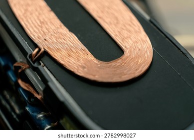 Explore the delicate strands of copper in this close-up view, capturing the essence of modern technology. The sleek design and careful crafting highlight artistry in electronics.