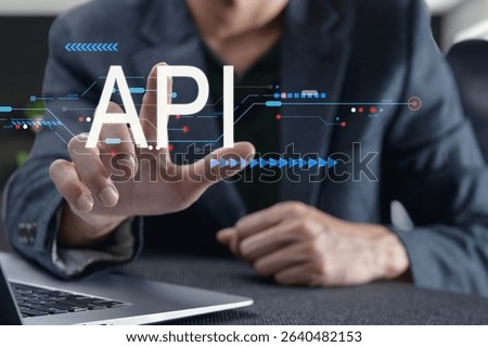 Explore the dynamic interaction between users and digital interfaces featuring API technology. This image highlights modern programming concepts and user experience.