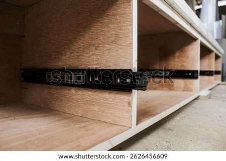 Explore the functionality of double extension drawer slides designed for furniture, particularly cabinets. These mechanisms allow for full drawer extension, maximizing accessibility and storage conven