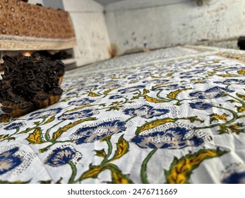 Explore the intricate art of block printing, a traditional technique where carved wooden blocks are used to imprint designs onto fabric. This ancient craft produces beautiful and vibrant colours - Powered by Shutterstock