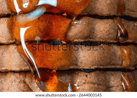 Explore the intricate macro textures of cookies drizzled with syrup showcasing delicious details in this close-up shot.