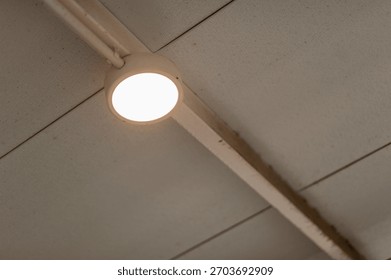 Explore lighting installation process with a detailed visual guide in a modern indoor setting.
