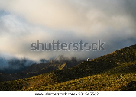 Explore the lush greenery and dramatic skies of Tenerife's mountainous terrain