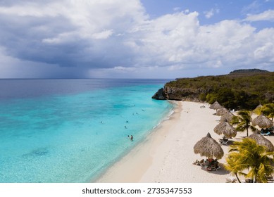 Explore the pristine waters and soft sands of Cas Abao Beach in Curacao. This tropical haven invites visitors to enjoy sunbathing, swimming, and the breathtaking scenery of the serene coastline.