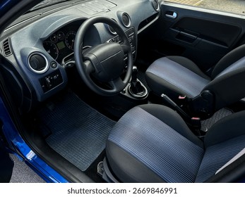 Explore a stunning car interior featuring a modern dashboard, plush seating, and an organized layout, highlighting exquisite automotive craftsmanship and sophistication