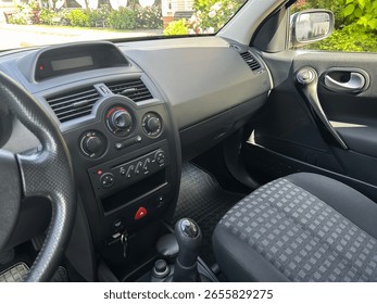Explore the stylish interior design of a modern car, featuring an elegant dashboard, plush seats, and userfriendly controls, perfect for automotive promotions