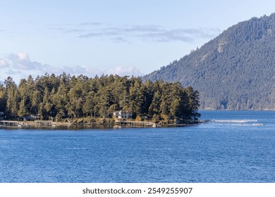 Explore the tranquil beauty of the Gulf Islands, BC, Canada. This scenic landscape showcases lush forests and calm blue waters, capturing the essence of peaceful coastal living. - Powered by Shutterstock