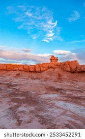 Explore the unique red rock formations under a bright blue sky in Goblin Valley, Utah, capturing the essence of natural beauty and desert landscapes.