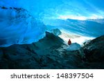 Explorer Inside Ice Cave, Mendenhall Glacier, Juneau, Alaska, USA