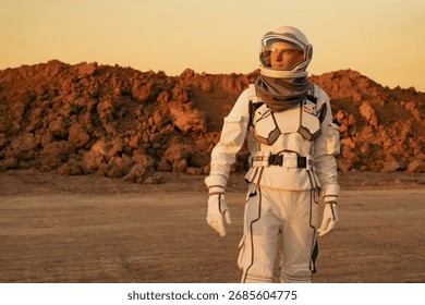 Explorer in spacesuit scanning the distant surface of Mars during planetary research.	