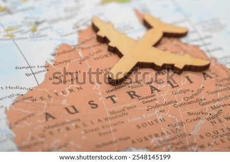 Exploring Australia: Plane and Map Concept for Travel, Tourism, and Adventure Planning