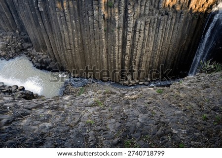 Exploring the basalt prisms in Hidalgo Mexico near the flowing river and waterfall