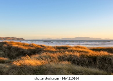 Exploring Beach Sand Dunes In The Sunset