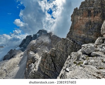Exploring the Dolomites via Via Ferrata delle Bocchette alpine hiking trail, Adamello Brenta Dolomites, Val di Sole, Trento, Alto Adige