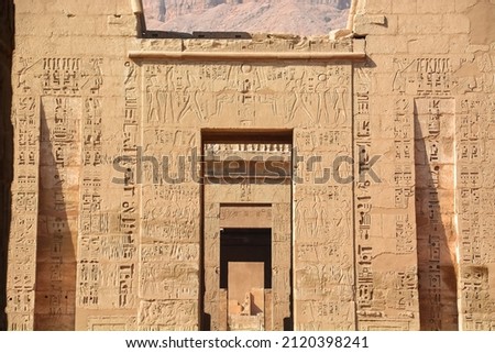 EXPLORING EGYPT - Massive columns inside beautiful Egyptian landmark with hieroglyphics, and ancient symbols. Famous landmark in the world near the Nile River and Luxor, Egypt