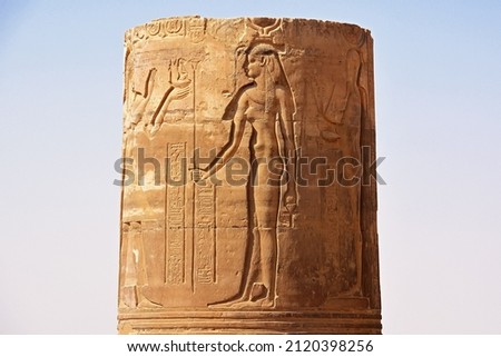 EXPLORING EGYPT - Massive columns inside beautiful Egyptian landmark with hieroglyphics, and ancient symbols. Famous landmark in the world near the Nile River and Luxor, Egypt