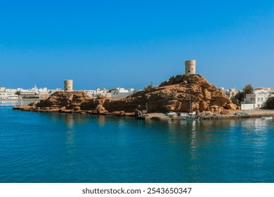 Exploring the historic coastal town of Sur Oman showcasing the scenic views and ancient towers by the tranquil waters - Powered by Shutterstock