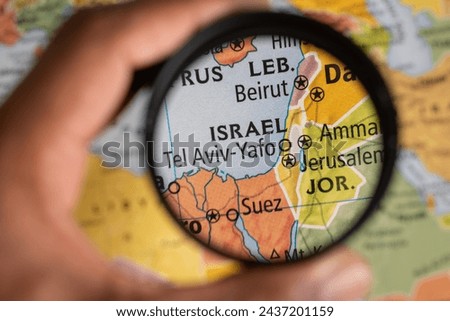 Exploring Israel location on a map under magnifying glass