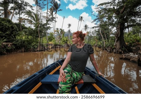 Exploring the lush riverways of Dominica while enjoying an adventurous boat ride