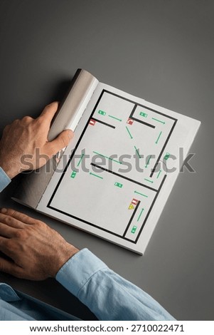 Exploring a maze layout in a manual during evening study session