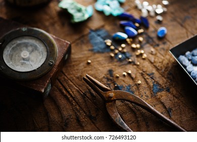 Exploring Mining, And Inspecting Gems. Treasure Hunting. Gold And Gems On Rough Wooden Surface.