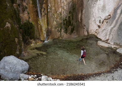 Exploring A Splendid Tiny Tall Waterfall and its lagoon for a Female Red Backpack Hiker - Sopota Waterfall, Tolmin, Julian Alps - Slovenia