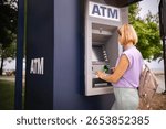 Exploring summer in Greece while visiting a local ATM