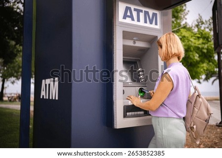 Exploring summer in Greece while visiting a local ATM