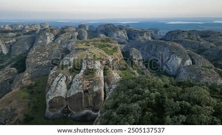Exploring the unique rock formations of the Pedras Negras Mountains in Angola at sunrise