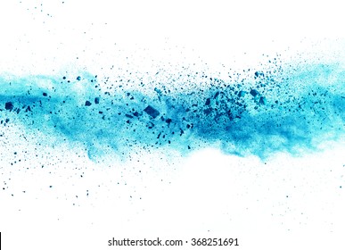 Explosion of blue powder on white background