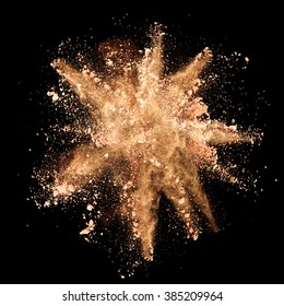 Explosion Of Brown Powder On Black Background