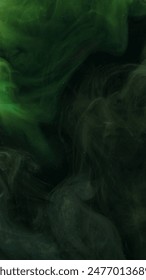 Explosion cloud. Ink water drop. Defocused green black color glitter texture ethereal smoke wave flow dark abstract art background.