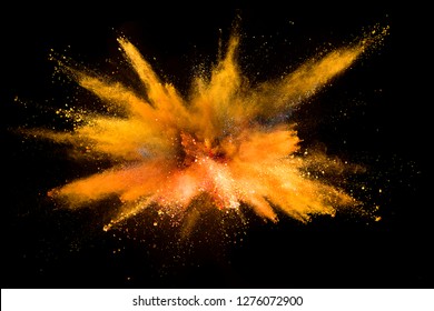 Explosion of colored powder isolated on black background. Abstract colored background Foto Stock
