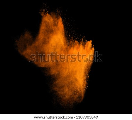 Explosion of colored powder isolated on whine background