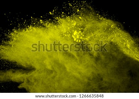 Explosion of colored powder, isolated on black background. Power and art concept, abstract blast of colors.