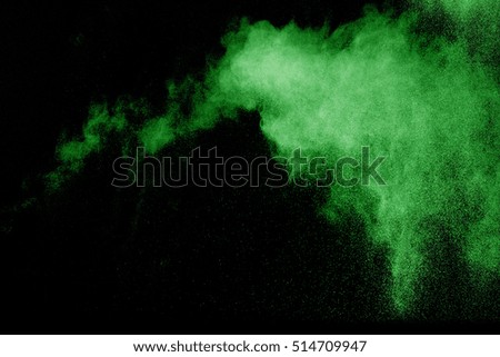 Explosion of colored powder on black background ,Freeze motion of color powder exploding/throwing color powder, multicolor glitter texture.
