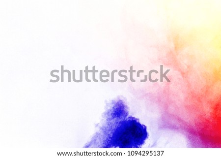 The explosion of colored powder on  white background.