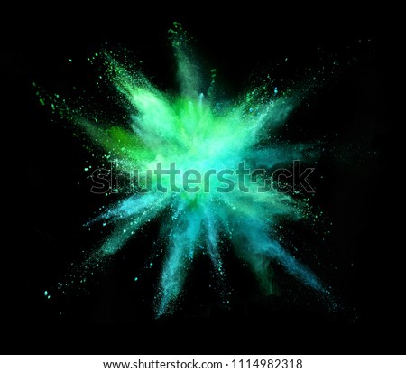 Explosion of coloured powder isolated on black background. Abstract background in high resolution.