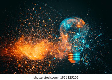 explosion of a filament light bulb. black background and blue and orange tones. high speed photography.