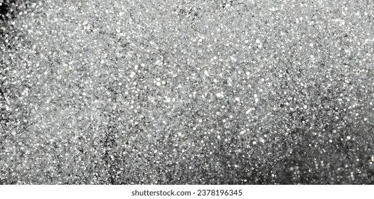 Explosion metallic silver glitter sparkle. Silver Glitter powder spark blink celebrate, blur foil explode in air, fly white glitters particle. Black background isolated, selective focus Blur bokeh - Powered by Shutterstock