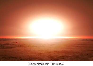 Explosion of nuclear bomb over land.