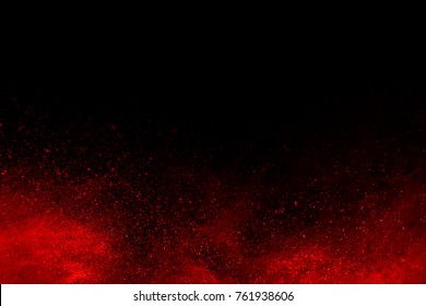 Explosion Of Red Powder On Black Background.