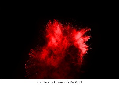 Explosion Of Red Powder On Black Background.