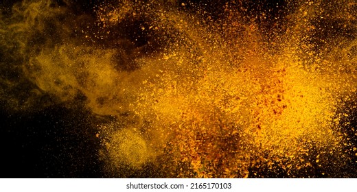 Explosion, Splashes of turmeric on a black background. India Seasoning. The orange powder of the turmeric root. Explosion of powder - Powered by Shutterstock