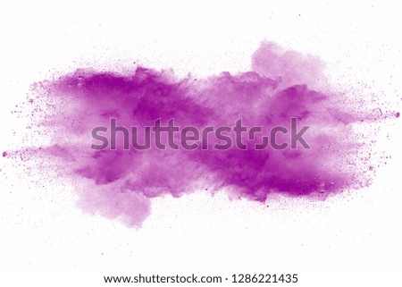 Explosion of violet dust on white background.