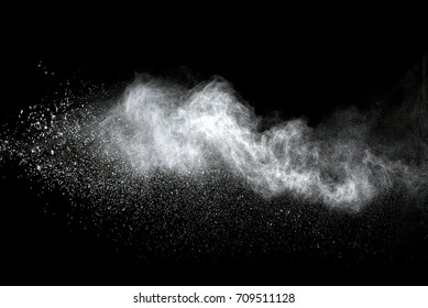 Explosion Of White Dust On Black Background.