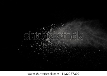 Explosion of white powder isolated on black background. Power or clouds splatted.