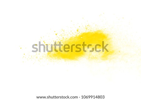 Explosion of yellow powder on white background