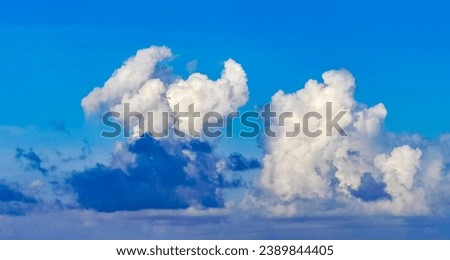 Explosive cloud formation cumulus clouds in the sky in Playa del Carmen Quintana Roo Mexico.